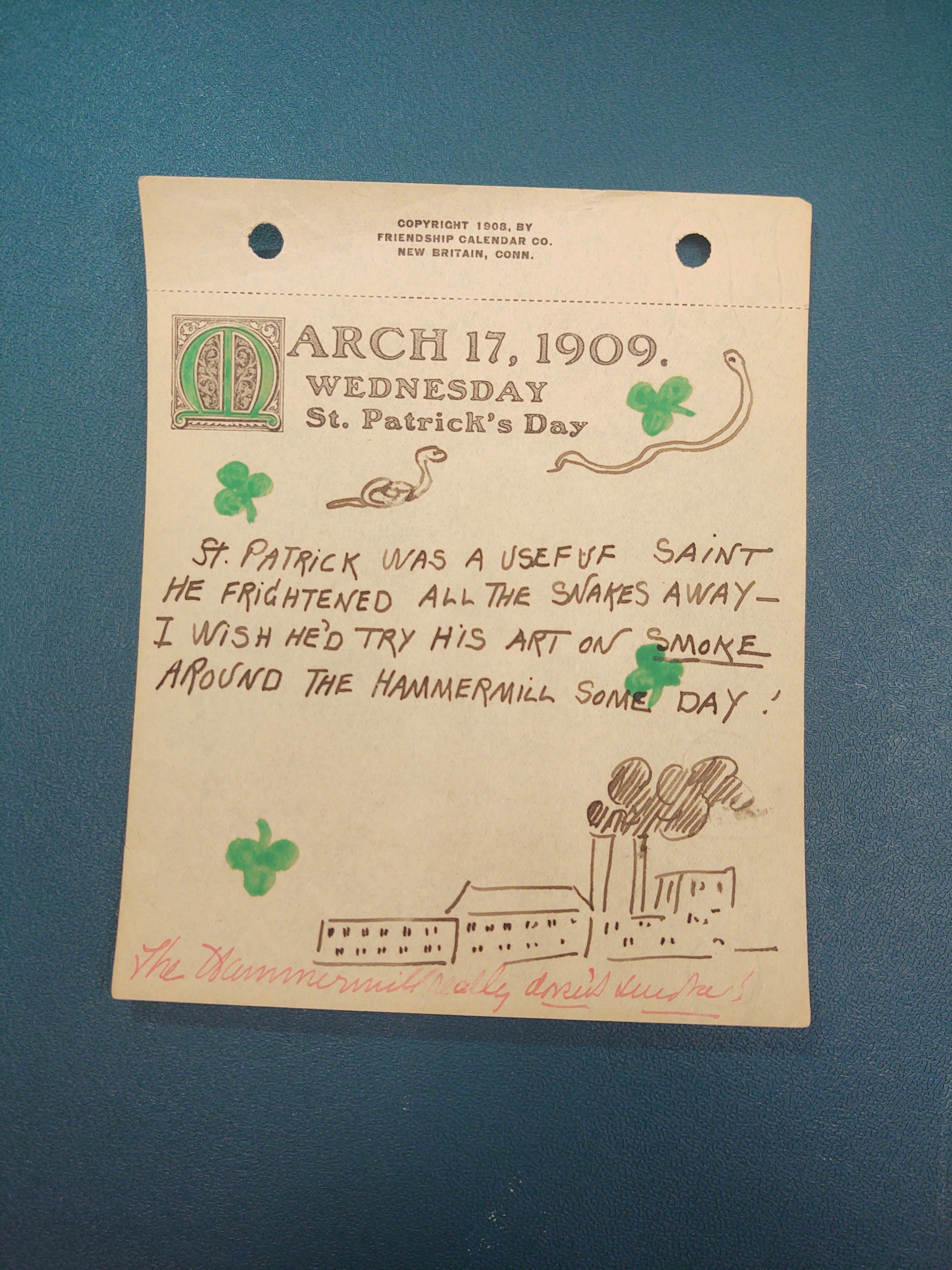 March 17, 1909. Wednesday: Green Shamrocks dispersed throughout the paper. Two snakes drawn on the top of the paper. A drawing of the Hammermill center at the bottom right corner.