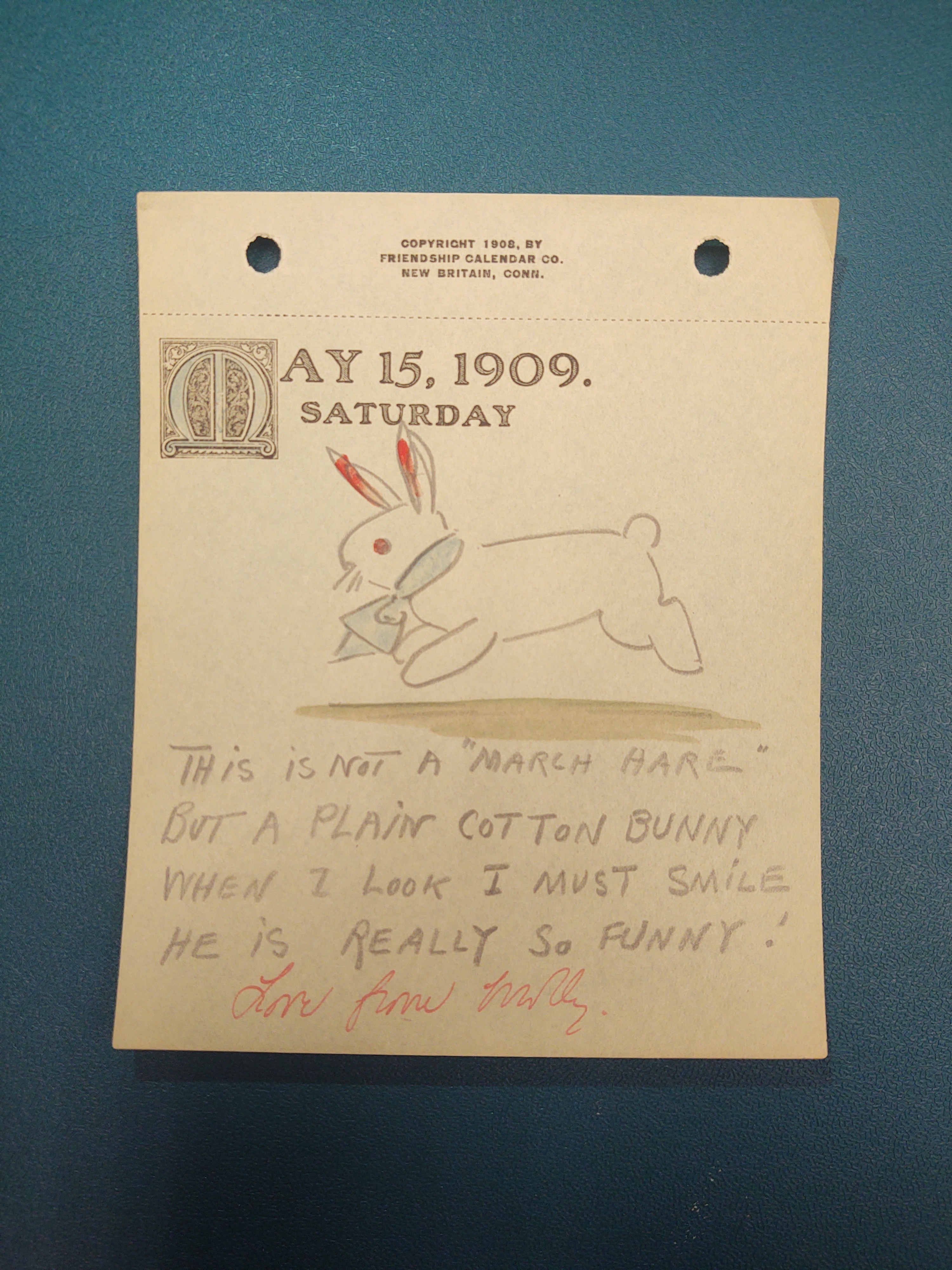 May 15, 1909. Saturday: Drawing of a bunny that is hopping with a blue tie around its collar and red ears.